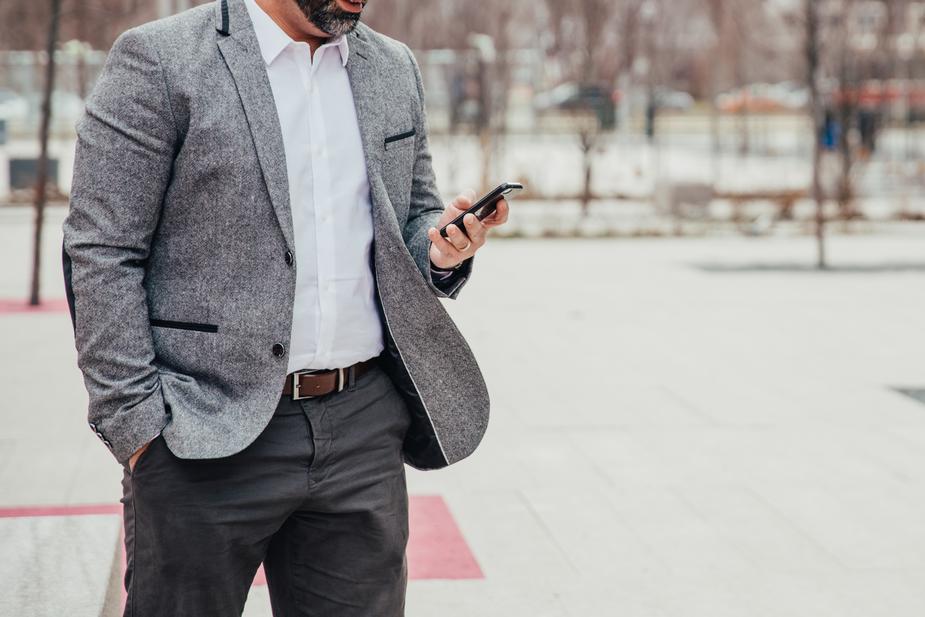 Business man checking phone